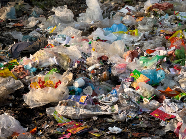 A detailed view of plastic waste accumulation in an urban area, shedding light on the growing pollution crisis and the urgent need for effective waste management and environmental sustainability. Background of plastic waste, urban pollution, environmental impact, waste accumulation, pollution crisis, plastic debris, garbage problem, urban waste management, environmental awareness, trash pollution, plastic pollution crisis, sustainability challenges, waste disposal issues, landfill pollution, garbage accumulation, plastic litter, urban cleanup, waste problem, ecological damage, recycling awareness, environmental crisis, pollution control, urban garbage, trash crisis, waste management solutions, environmental sustainability, urban litter problem, plastic garbage, ecological impact, urban trash