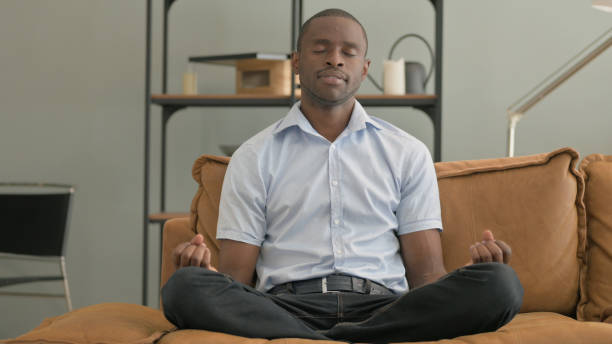 istock African Man Doing Yoga at Home 2194815312
