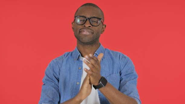 hakini mudra hand gesture of a white man in a black background with a coat suit