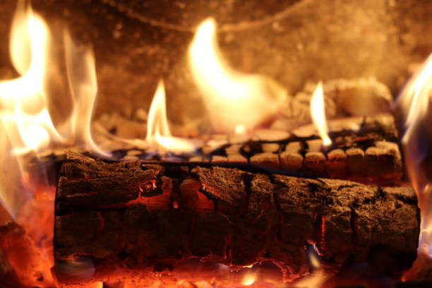 istock Close up of flames on logs in a fireplace 2194816534