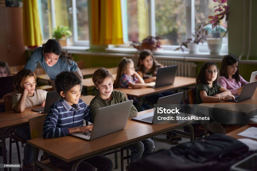 Elearning Elementary Elementary Students Elearning Over Laptops In The Classroom Stock Photo ...