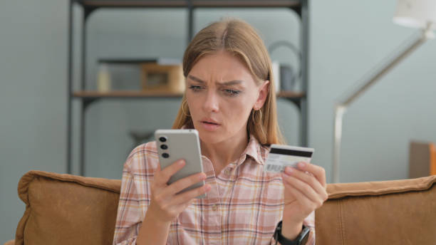 istock Online Banking Failure for Young Woman while Sitting on Sofa at Home 2194816640