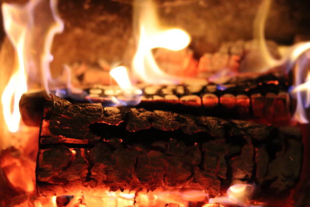 istock Close up of flames on logs in a fireplace 2194816671