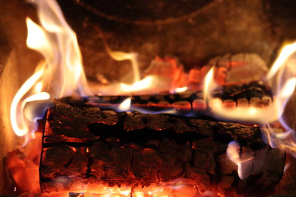 istock Close up of flames on logs in a fireplace 2194816740