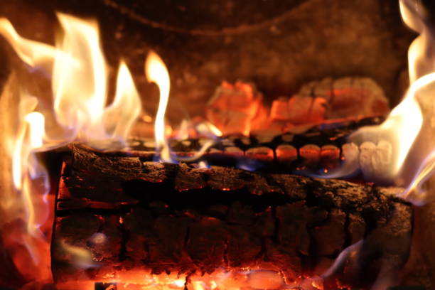 istock Close up of flames on logs in a fireplace 2194816772
