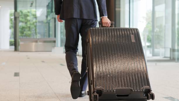 istock A businessman walking with a suitcase 2194817058