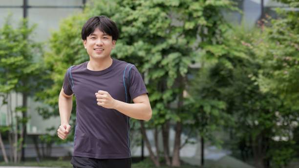 istock Man jogging in the city 2194817077