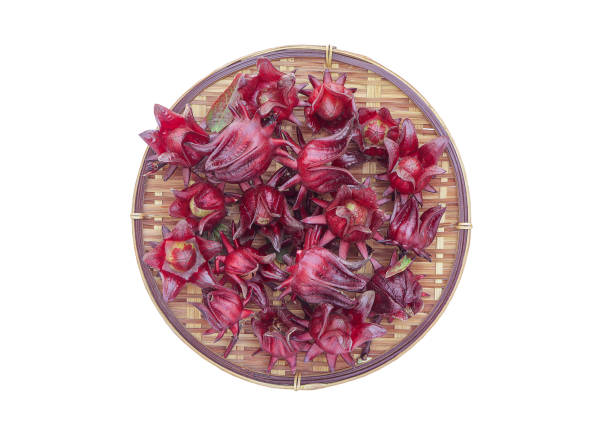 istock Fresh red roselle fruit (Jamaican sorel) Hibiscus sabdariffa Linn on a sieve with clipping path, from above. 2194819837