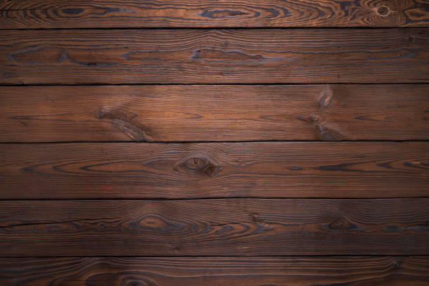 istock Dark Brown Wooden Plank Background with Visible Grain Texture and Details 2194822198