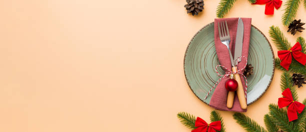 istock Christmas table place setting with christmas decor and plates, kine, fork and spoon. Christmas holiday background. Top view with copy space 2194822250