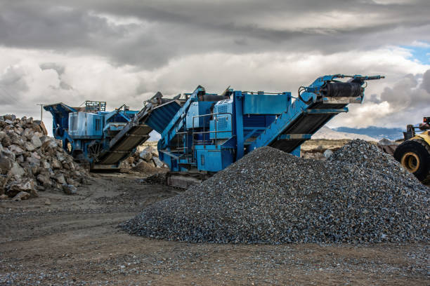 istock Heavy and mobile machinery in a quarry to transform stone into construction material 2194822423