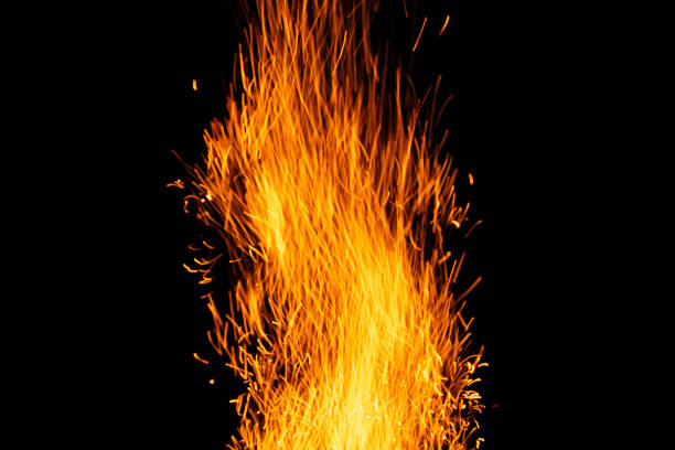 istock sparks from the fire glowing in the dark 2194822603