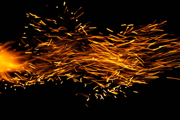sparks from the fire glowing in the dark