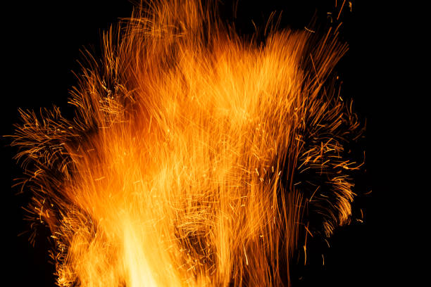 sparks from the fire glowing in the dark