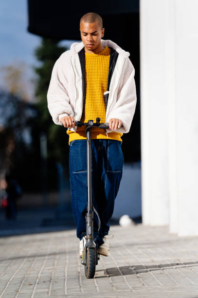 istock Young man riding electric scooter in the city 2194822664