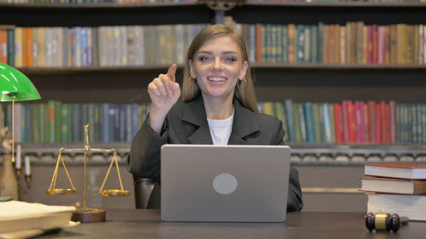 istock Female Lawyer Pointing at Camera with Laptop 2194822737