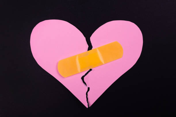 istock Broken heart and adhesive bandage 2194823910