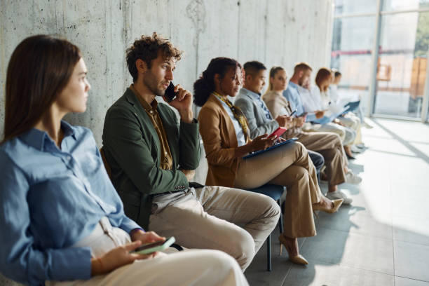 istock Large group of candidates waiting for a job interview. 2194823929