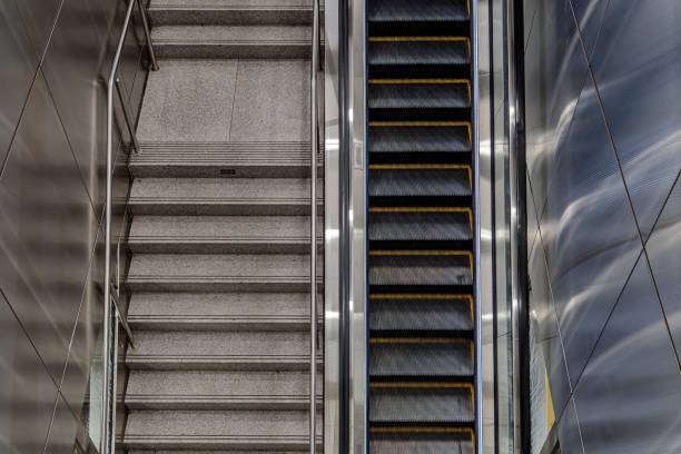 istock Escalator and stairs in a modern subway station. 2194825814