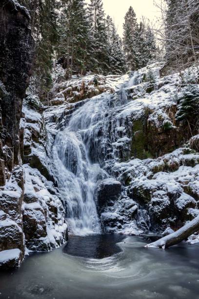istock Frozen waterfall in a snowy winter landscape. 2194825963