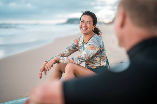 Joyful Surfing Couple Relaxing on Gold Coast Beach