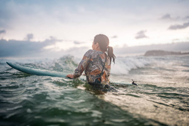 istock Skilled Asian Female Surfer Navigating Waves at Gold Coast Beach 2194826691