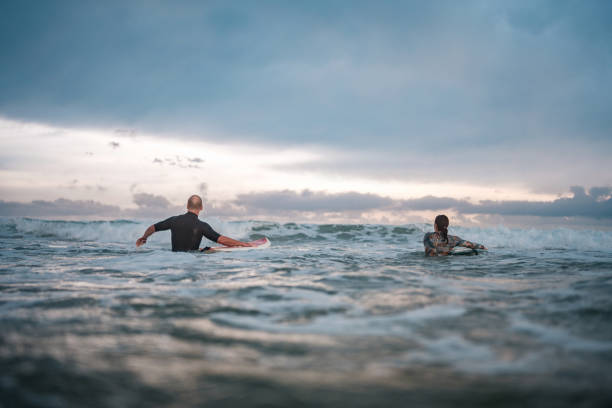 istock Joyful Surfing Duo on Gold Coast Waves 2194826702