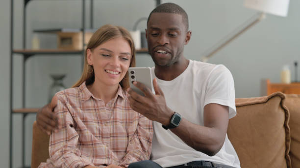 istock Interracial Couple Doing Video Chat on Phone at Home 2194827606