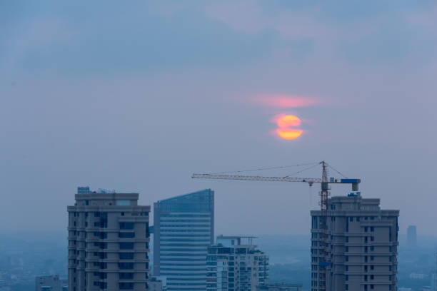 istock Buildings and cranes at sunrise 2194828350