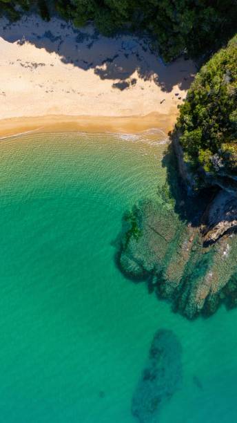 istock Aerial view of serene beach and turquoise waters. 2194828579