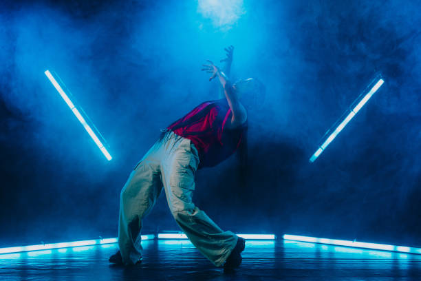 istock Hip hop dancer dancing in a cool studio with neon lights. 2194831212