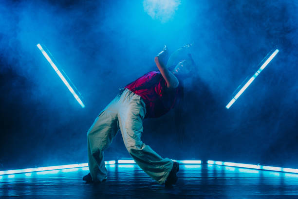 istock Hip hop dancer dancing in a cool studio with neon lights. 2194831261