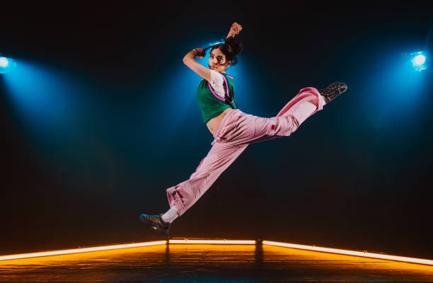 istock Hip hop dancer dancing in a cool studio with neon lights. 2194831340
