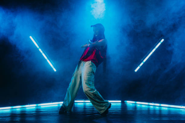 istock Hip hop dancer dancing in a cool studio with neon lights. 2194831406
