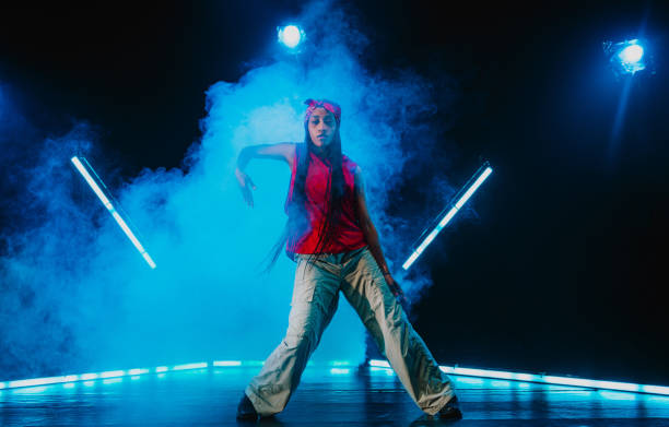 istock Hip hop dancer dancing in a cool studio with neon lights. 2194831497