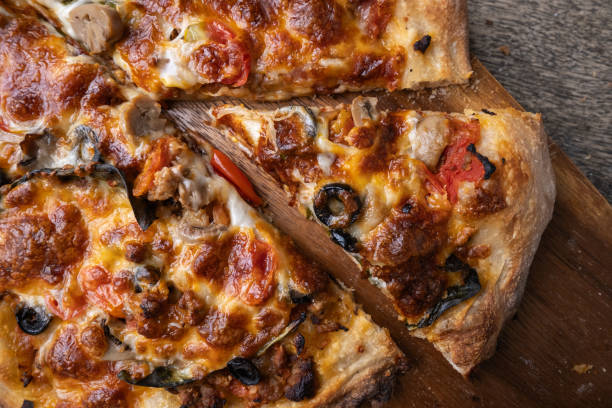 istock Homemade Sourdough pizza on Wooden Table. 2194832066
