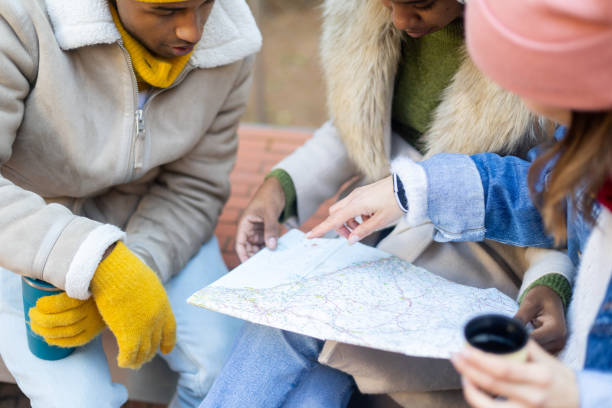 istock Tourists consulting a map on a winter day trip 2194832659