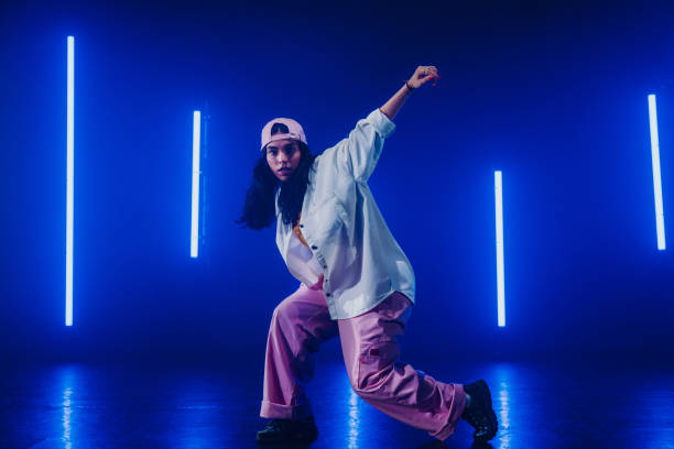istock Hip hop dancer dancing in a cool studio with neon lights. 2194832990