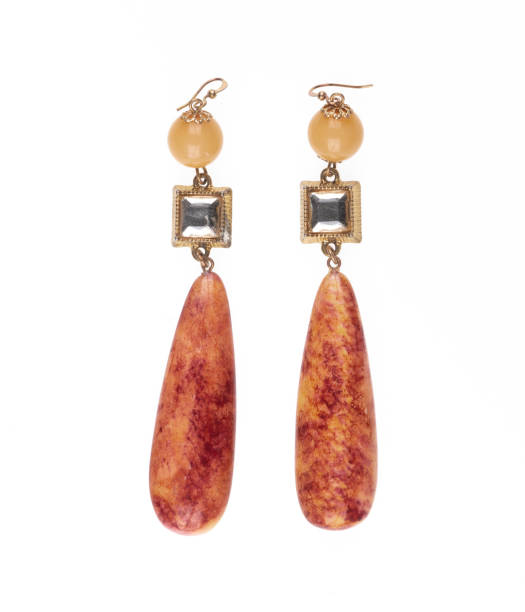 istock jewelry earrings with orange stone isolated on white background 2194836038