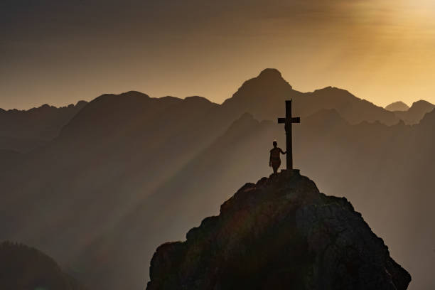 istock Sunset with a summit cross in Berchtesgaden, Bavarian Alps 2194837171