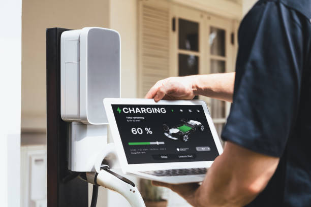 istock Qualified technician working with laptop for home EV station. Synchronos 2194838691