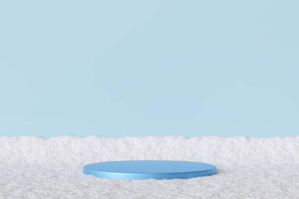 Elegant blue podium on snowy surface with soft blue background, perfect for showcasing products in minimal winter-themed setting. Ideal for holiday campaigns, branding, modern displays. 3D render.