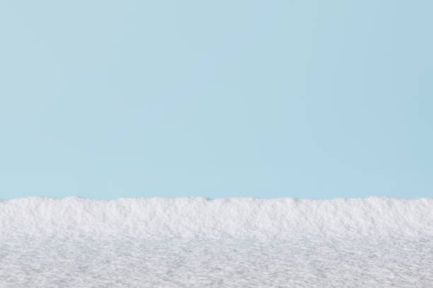 istock Clean snowy foreground with a bright blue sky backdrop. Minimalistic winter landscape perfect for seasonal designs, holiday themes, or serene natural compositions. Copy space for text. 3D rendering. 2194838962