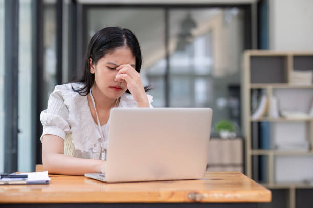 istock Stressed Asian businesswoman experiencing frustration while working on a laptop in a modern office 2194838986