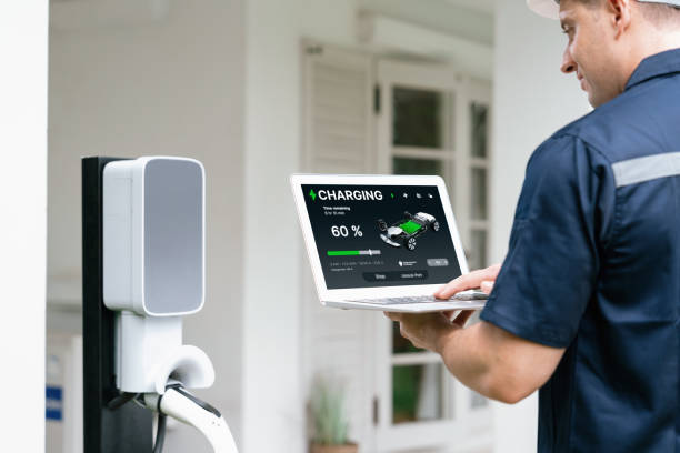 istock Qualified technician working with laptop for home EV station. Synchronos 2194839991