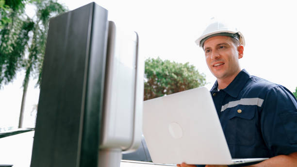 istock Qualified technician working with laptop for home EV station. Synchronos 2194841427