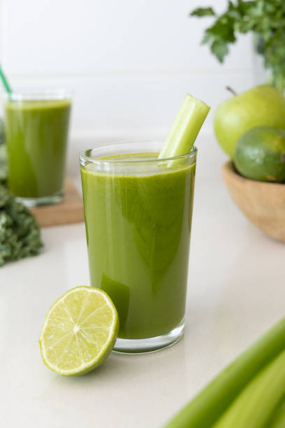 istock Green Detox Juice on White Kitchen Counter 2194842865
