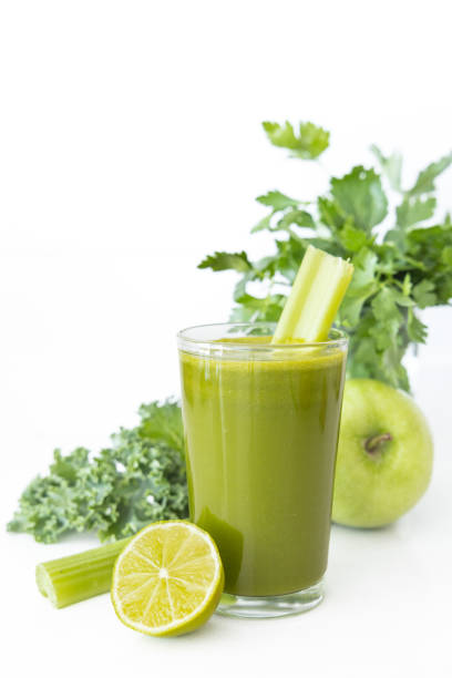 Close-up of a vibrant green detox juice made with kale, celery, lemon, ginger, and green apple, promoting weight loss, immune support, and detox benefits