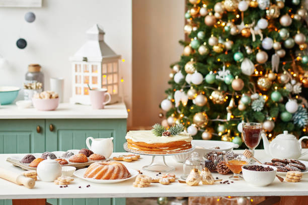 istock Christmas cake and sweets on table. Christmas decorations with lights background. Happy New Year! Christmas greeting card. Winter card template. Xmas concept. Holiday Banner. Feast of Nativity. 2194843327