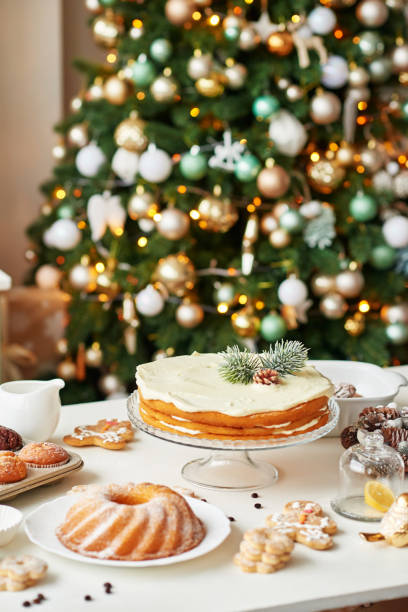 istock Christmas cake and sweets on table. Christmas decorations with lights background. Happy New Year! Christmas greeting card. Winter card template. Xmas concept. Holiday Banner. Feast of Nativity. 2194843418